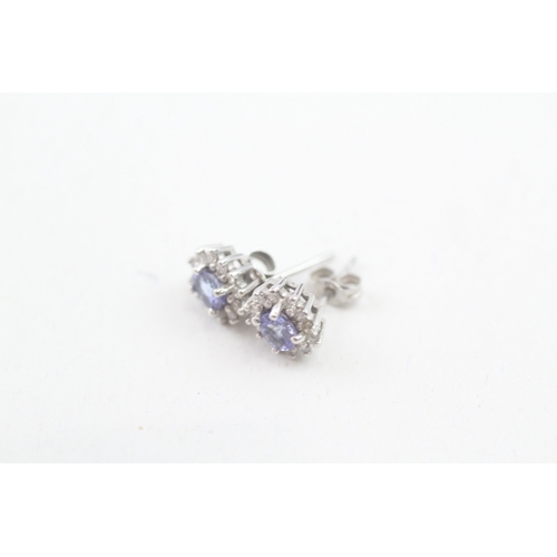 5 - 9ct white gold tanzanite and diamond halo stud earrings (1.2g)