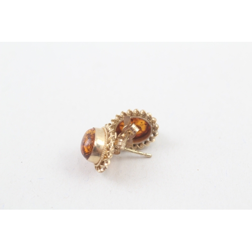 63 - 9ct gold vintage amber cabochon stud earrings (1.5g)