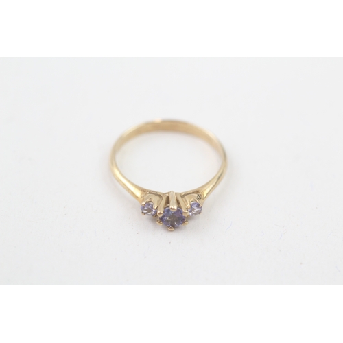 71 - 9ct gold tanzanite three stone ring, claw set (1.7g) Size  O