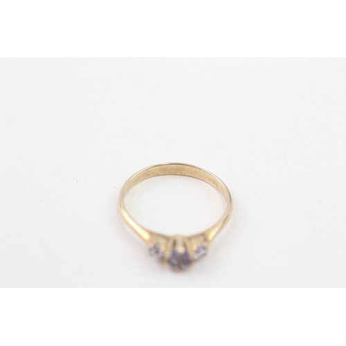 71 - 9ct gold tanzanite three stone ring, claw set (1.7g) Size  O