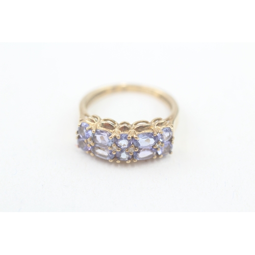 76 - 9ct gold tanzanite and diamond multi row dress ring (2.9g) Size  N