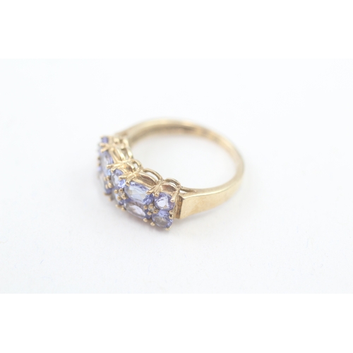 76 - 9ct gold tanzanite and diamond multi row dress ring (2.9g) Size  N