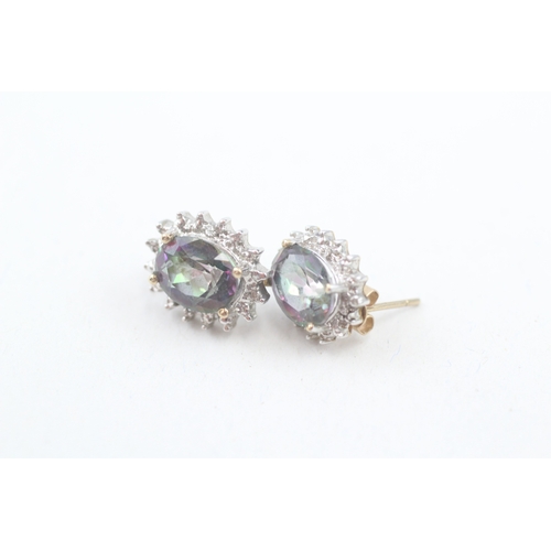 77 - 9ct gold diamond & mystic topaz oval cluster stud earrings (3.4g)