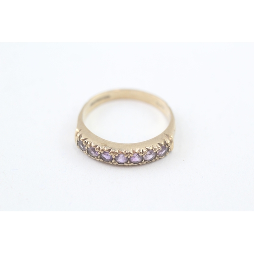 78 - 9ct gold vintage amethyst half eternity ring with patterned shoulders (2.9g) Size  P