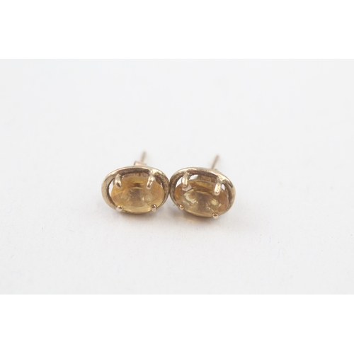 94 - 9ct gold citrine oval cut stud earrings (1.6g)