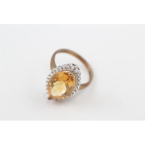 99 - 9ct gold citrine and diamond marquise halo cocktail ring (3.8g) Size  N