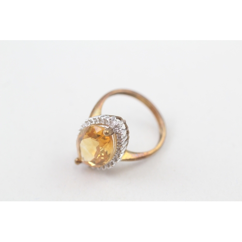 99 - 9ct gold citrine and diamond marquise halo cocktail ring (3.8g) Size  N