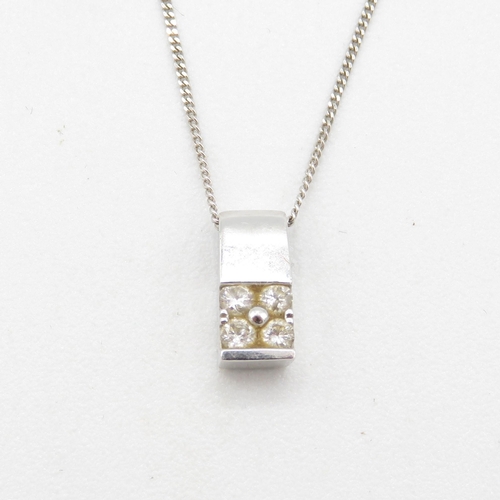 227 - 18ct gold  four stone diamond pendant on a 9ct gold chain 1.9g