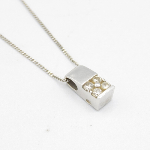 227 - 18ct gold  four stone diamond pendant on a 9ct gold chain 1.9g