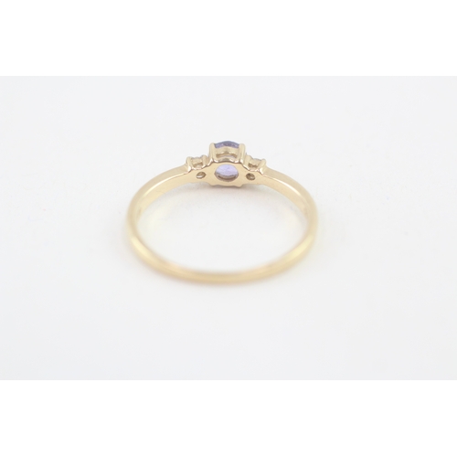 106 - 14ct gold tanzanite & diamond three stone ring (1.9g) Size  P