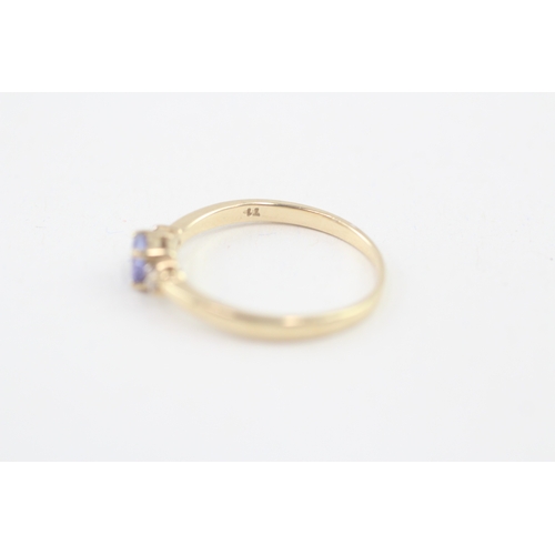 106 - 14ct gold tanzanite & diamond three stone ring (1.9g) Size  P