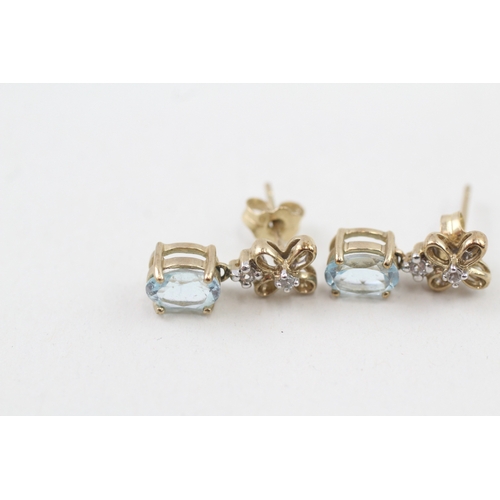 17 - 9ct gold blue topaz & diamond floral drop earrings with scroll backs (2.4g)