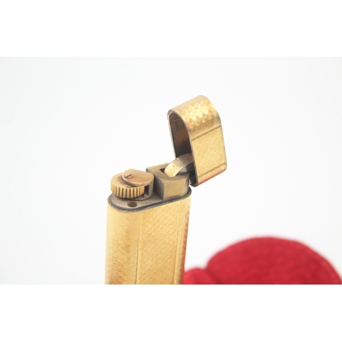 460 - A Cartier Paris Gold Plated Pocket Lighter In Suede Pouch w/ Guilloche Finish