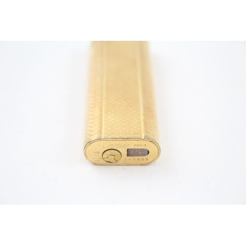 460 - A Cartier Paris Gold Plated Pocket Lighter In Suede Pouch w/ Guilloche Finish