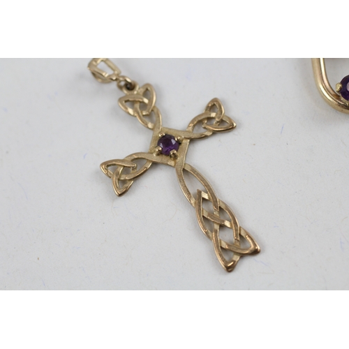 63 - 2x 9ct gold amethyst pendants including a celtic cross (2.1g)