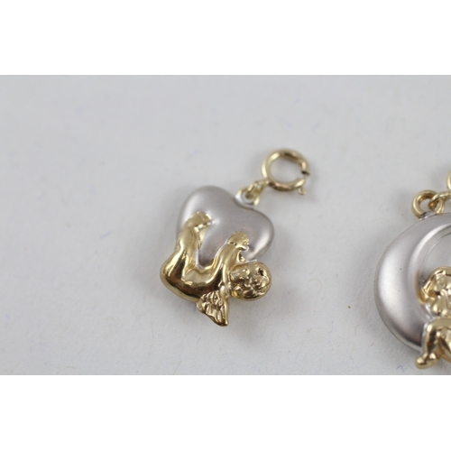 65 - 2x 9ct gold cherub with crescent & heart charms (1.2g)