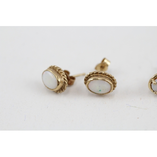 72 - 2x 9ct gold opal stud earrings with scroll backs (2.3g)