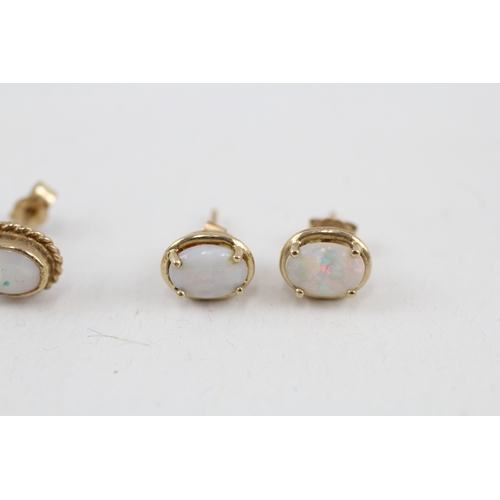 72 - 2x 9ct gold opal stud earrings with scroll backs (2.3g)