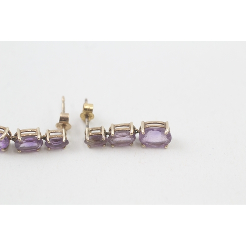 91 - 9ct gold graduated oval cut amethyst drop earrings (1.6g)