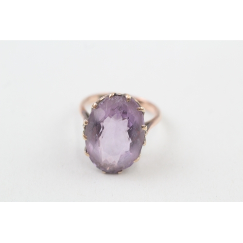 96 - 9ct gold oval cut amethyst dress ring (5.4g) Size  L