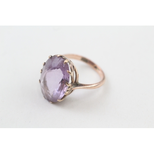 96 - 9ct gold oval cut amethyst dress ring (5.4g) Size  L