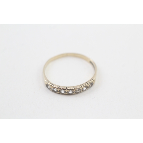 15 - 9ct gold white gemstone half eternity ring (1.1g) AS SEEN - MISHAPEN Size  N