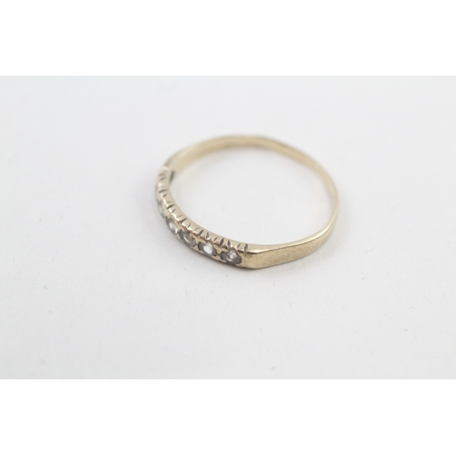 15 - 9ct gold white gemstone half eternity ring (1.1g) AS SEEN - MISHAPEN Size  N