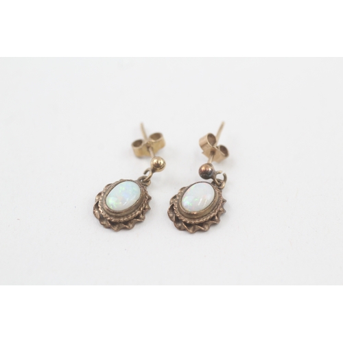 27 - 9ct gold opal drop earrings with scroll backs (2g)