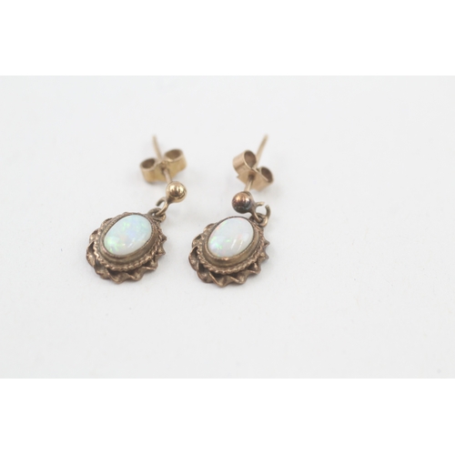 27 - 9ct gold opal drop earrings with scroll backs (2g)