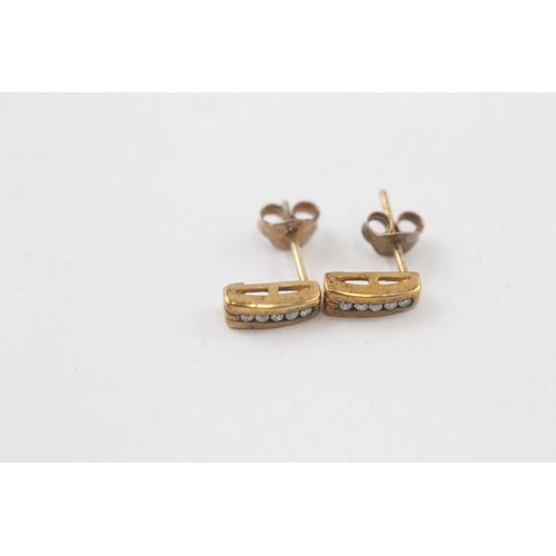 36 - 9ct gold diamond stud earrings with scroll backs (1.1g)