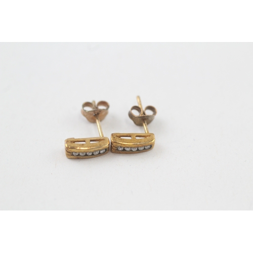 36 - 9ct gold diamond stud earrings with scroll backs (1.1g)