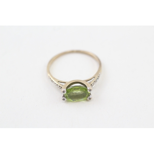 49 - 9ct gold oval cut peridot & diamond dress ring (1.5g) Size  K 1/2