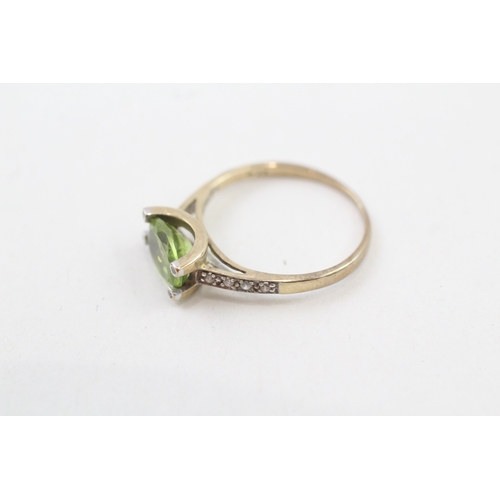 49 - 9ct gold oval cut peridot & diamond dress ring (1.5g) Size  K 1/2