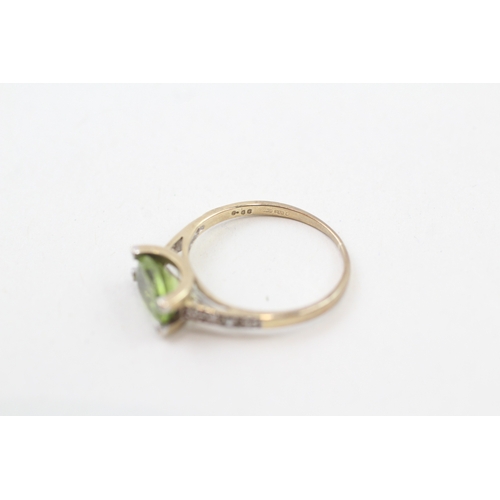 49 - 9ct gold oval cut peridot & diamond dress ring (1.5g) Size  K 1/2