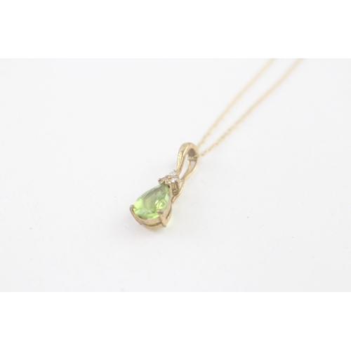 51 - 9ct gold pear cut peridot & diamond pendant necklace (2.1g)