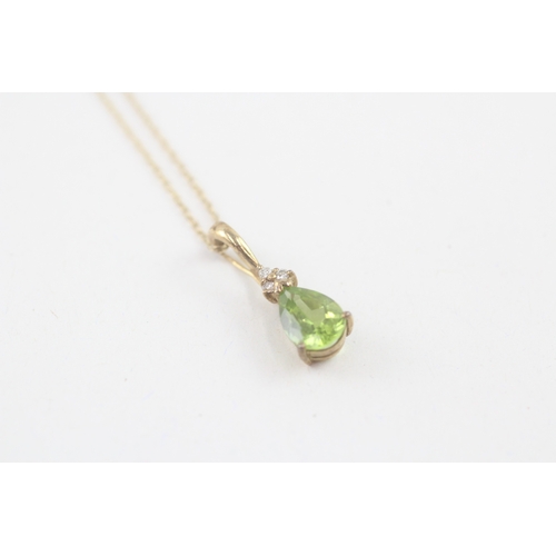 51 - 9ct gold pear cut peridot & diamond pendant necklace (2.1g)