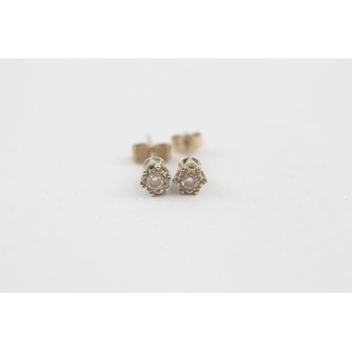 54 - 9ct gold diamond stud earrings (0.6g)