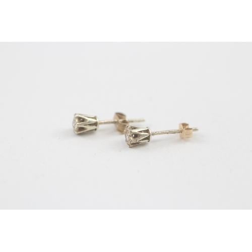 54 - 9ct gold diamond stud earrings (0.6g)