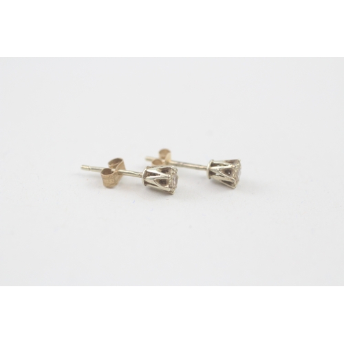 54 - 9ct gold diamond stud earrings (0.6g)