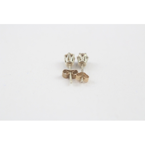 54 - 9ct gold diamond stud earrings (0.6g)