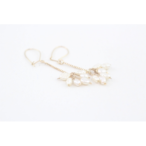 58 - 9ct gold rice pearl drop earrings (1.3g)