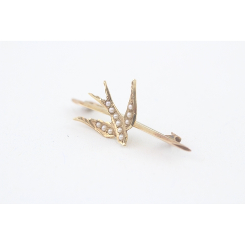 62 - 15ct gold victorian seed pearl swallow brooch (1.5g)