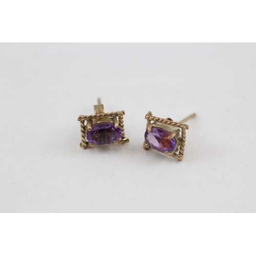 74 - 2x 9ct gold amethyst pendant & stud earrings set (1.7g)