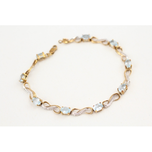 89 - 9ct gold topaz and diamond set line bracelet (5.8g)