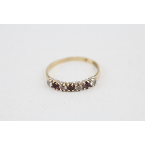 90 - 9ct gold amethyst and cubic zirconia seven stone eternity ring (1.3g) AS SEEN - MISHAPEN Size  N