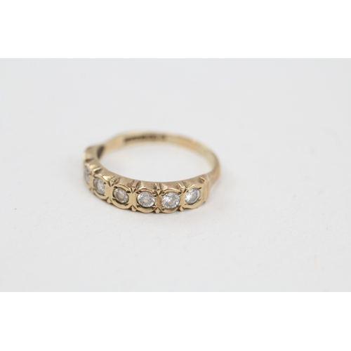 91 - 9ct gold cubic zirconia seven stone eternity ring (1.8g) Size  M