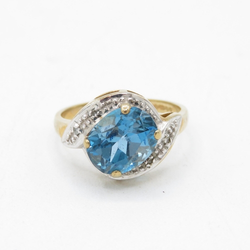 27 - 9ct gold blue topaz & diamond dress ring (2.3g) Size  I 1/2