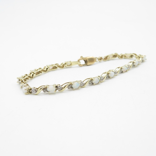 41 - 9ct gold opal and diamond tennis bracelet (6.7g)