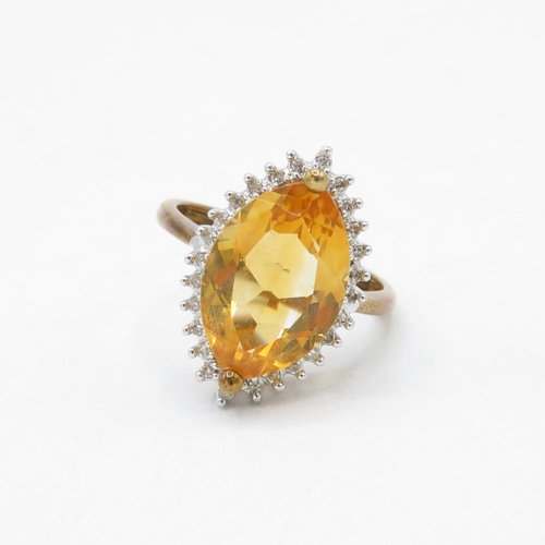 99 - 9ct gold citrine and diamond marquise halo cocktail ring (3.8g) Size  N