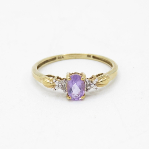 149 - 9ct gold amethyst single stone ring with diamond sides (1.8g) Size  O